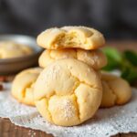 Freshly baked vanilla cookies cooling on a wire rack, golden brown with a soft and chewy texture